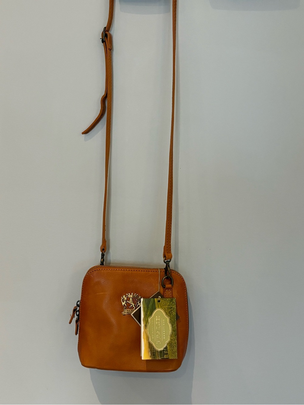 PratesiTan Leather Crossbody Bag with Crest Accent